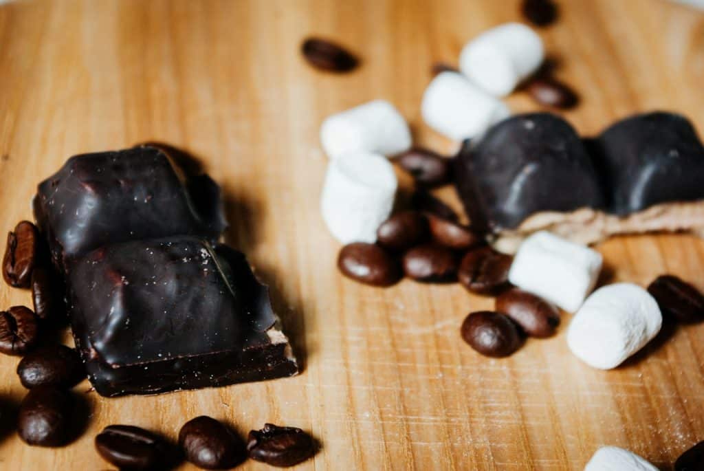 black and white chocolate on brown wooden table